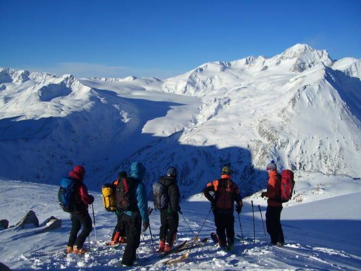 Ski touring group with mountains in the background