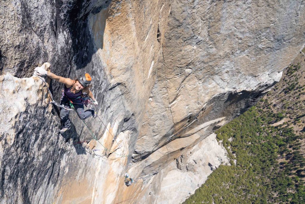 (Photo by: Nick Smith) - Female rock climber, Browyn Hodgins, holding onto cliff with one hand