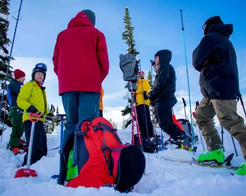 Group learning how to use probes in Whistler backcountry