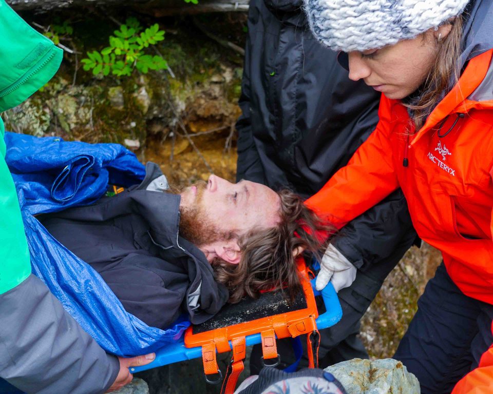 Students learning how to transport patient